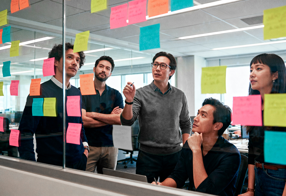 brainstorming session with sticky notes glass 1 | Global Workforce Planning for SMEs: Hiring Across Asia Without Complexity