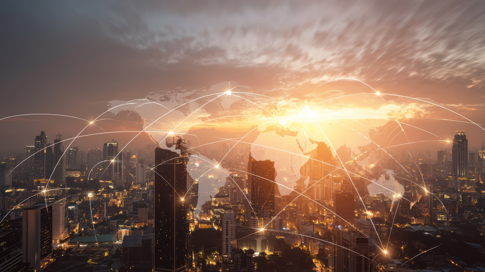 global network connectivity modern city skyline sunset | 6 Key Challenges of Cross-Border Hiring and How Global Employers Can Overcome Them